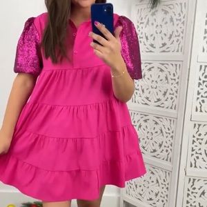 Short hot pink dress with sequin sleeves